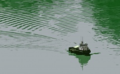 Image Of A Model Tug Boat On Water