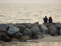 Man And Woman At The Ocean