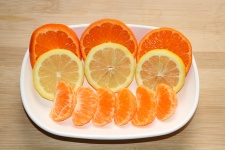 Orange And Lemon Slices On Plate