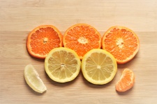 Orange And Lemon Slices On Wood