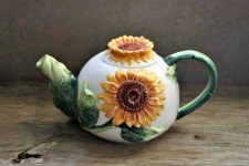 Sunflower Tea Pot On Wood