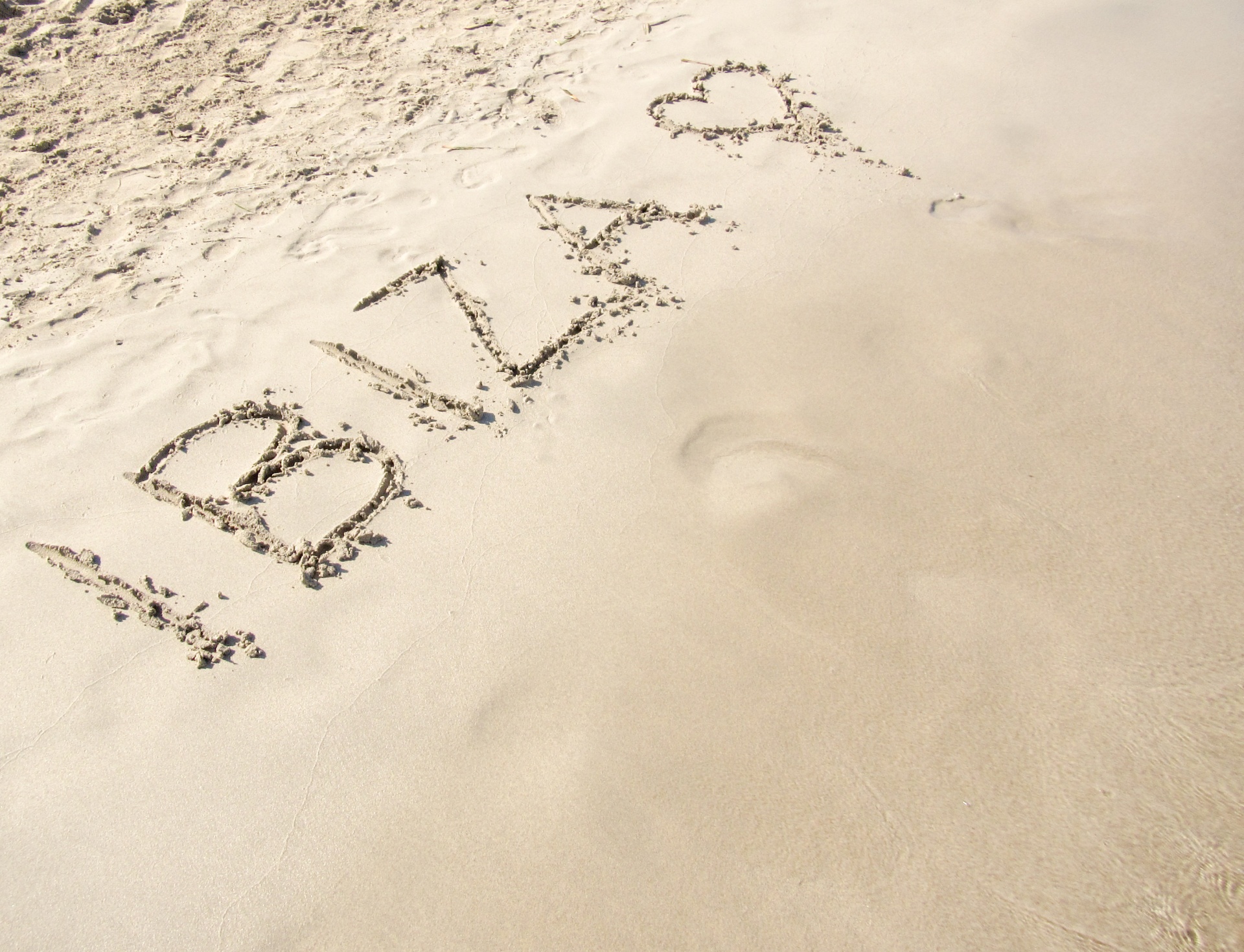 Ibiza text on a sandy beach in Ibiza - Spain