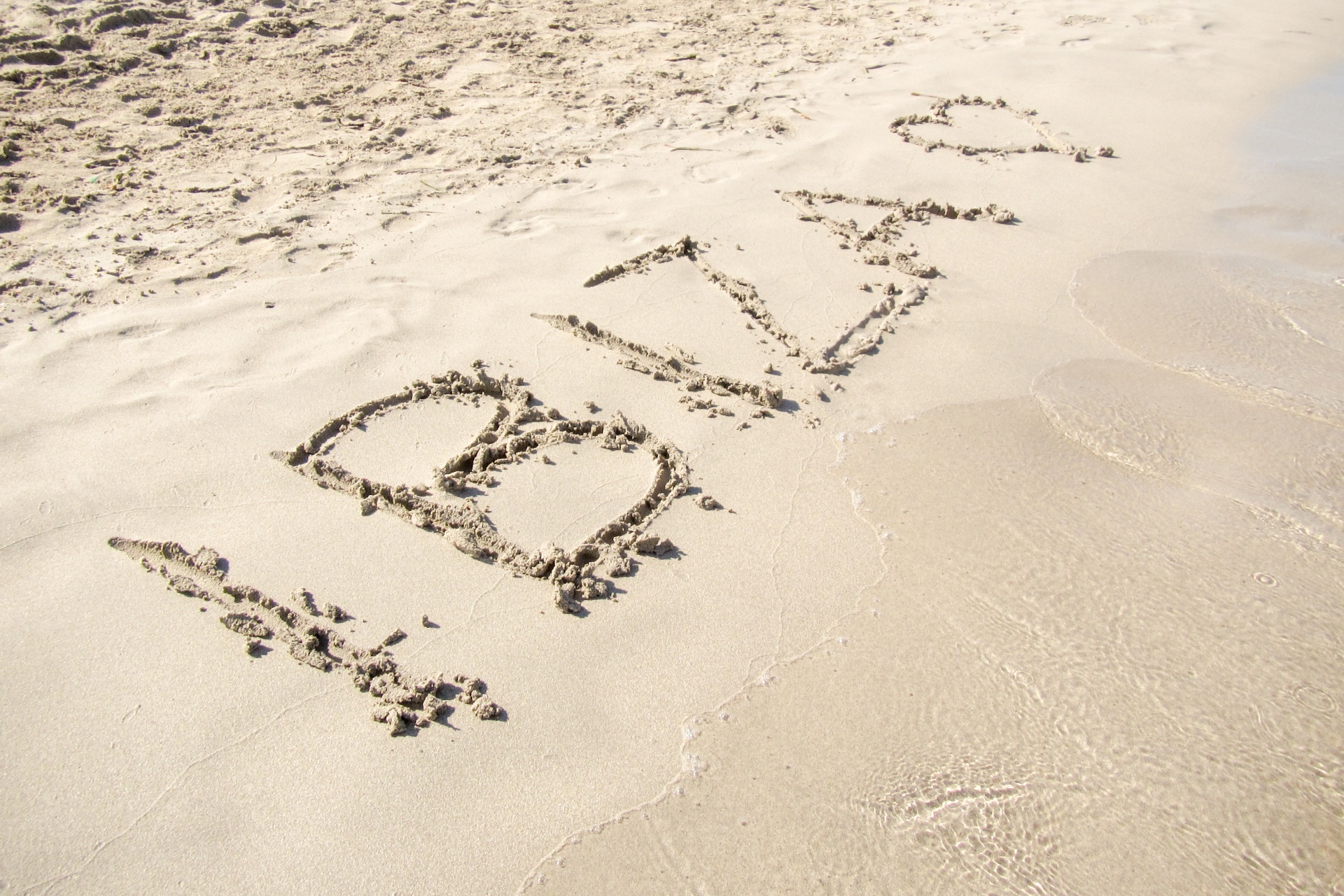 Ibiza text on a sandy beach in Ibiza - Spain