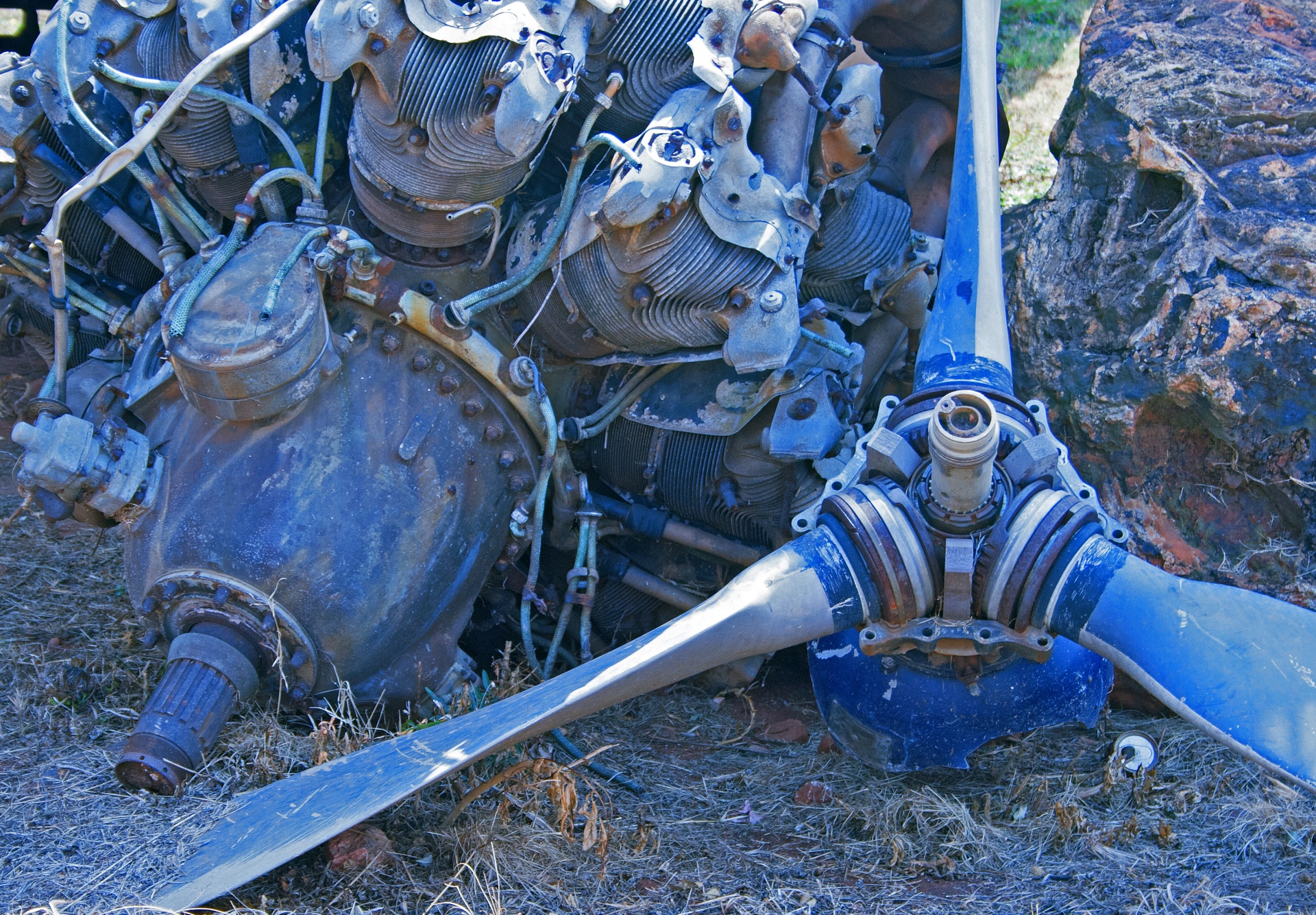 propeller of a staged crashed aircraft lying next to the engine