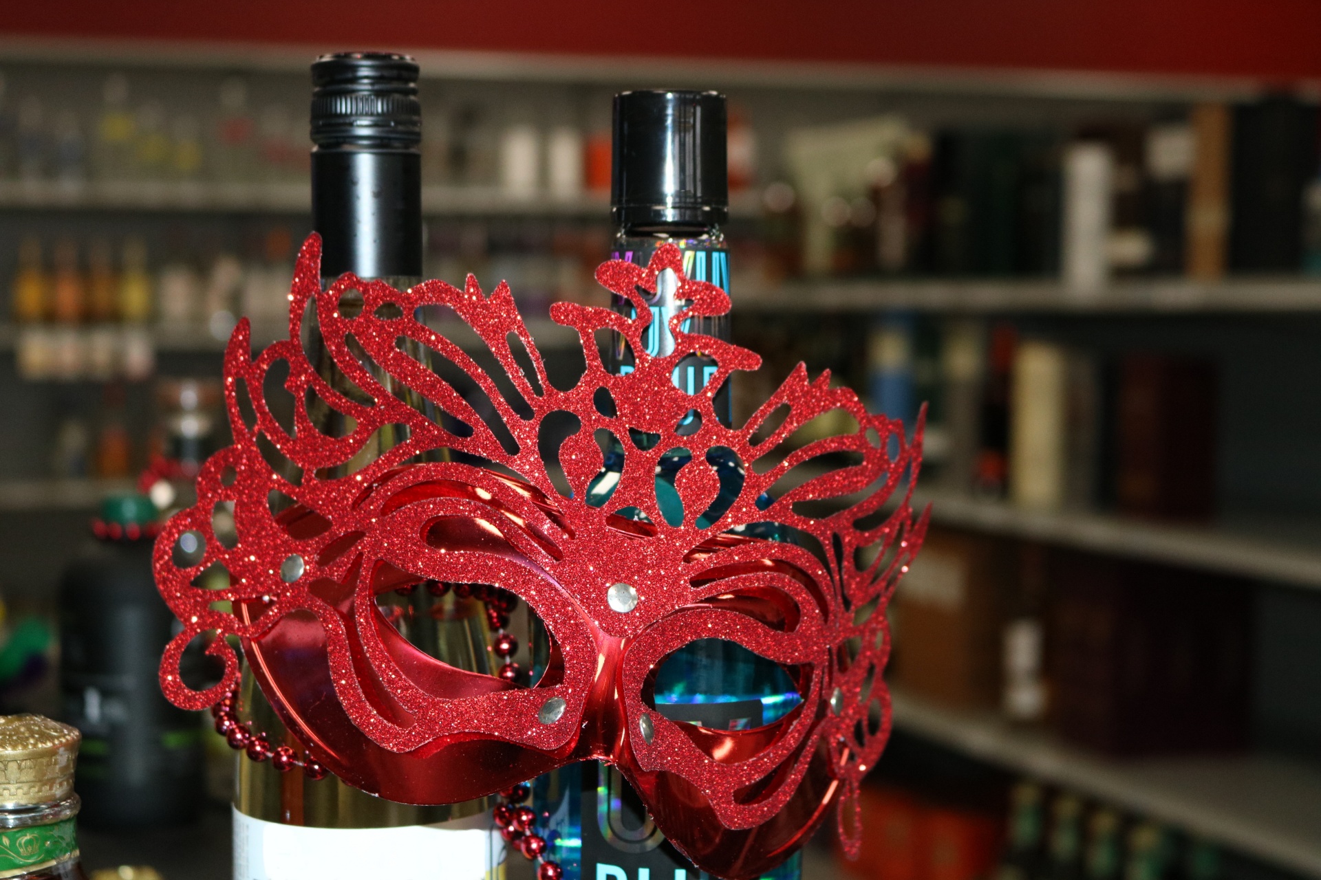Red Mardi Gras Mask On Bottles
