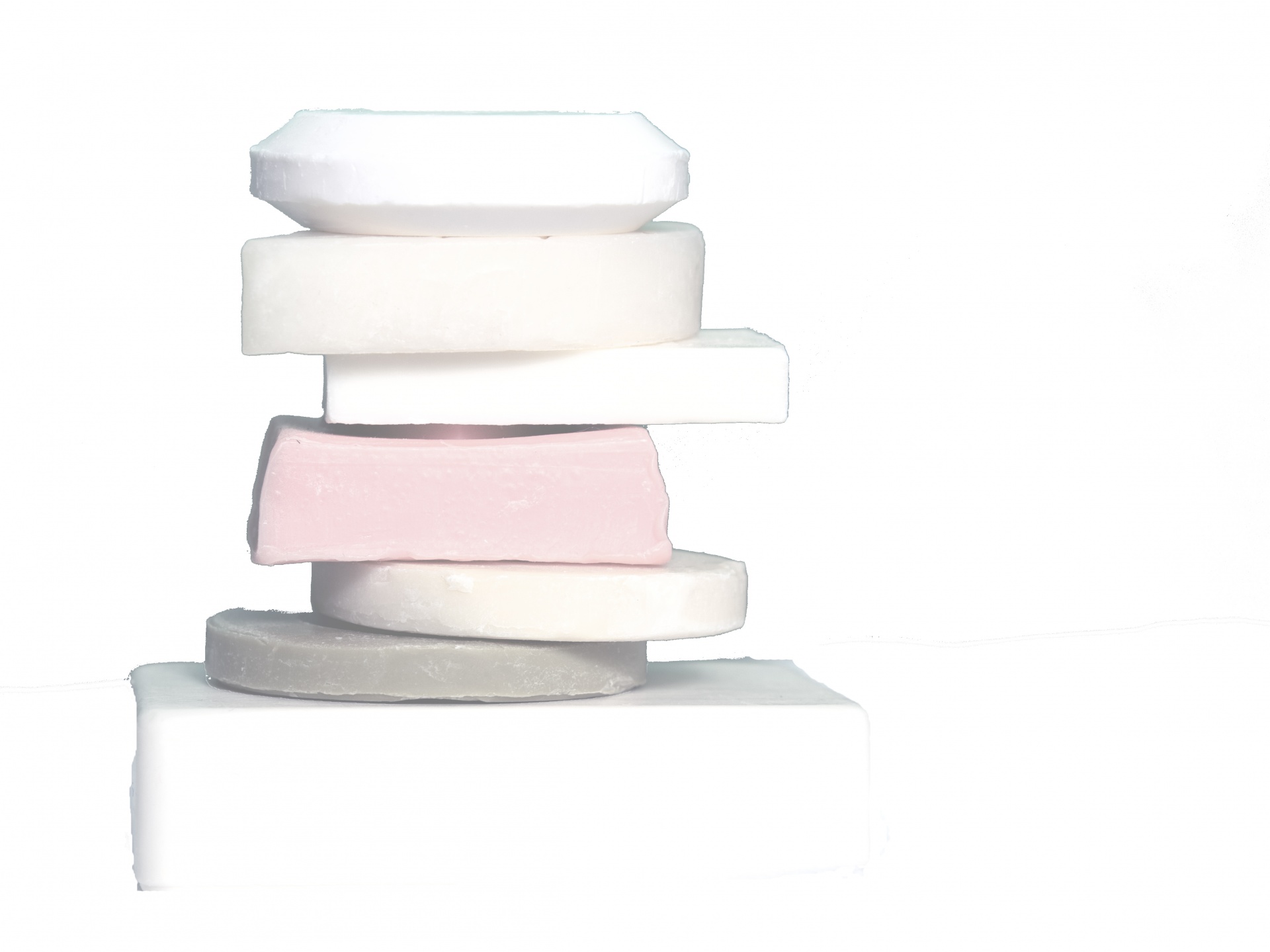 Stack of soap bars in a white atmosphere for background