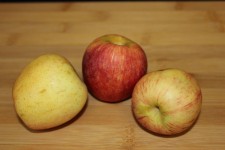 3 Apples On A Chopping Board