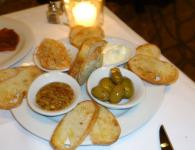 Bread With Dipping Sauce And Olives