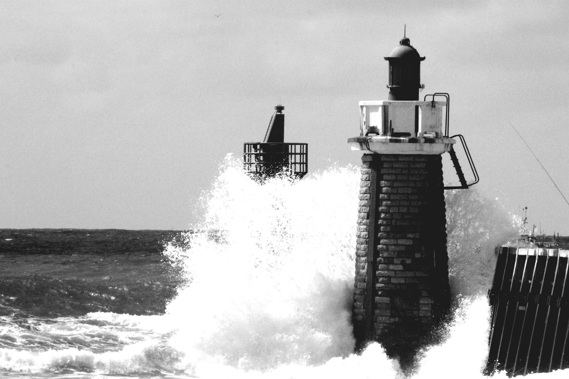 French Waves hitting a light house