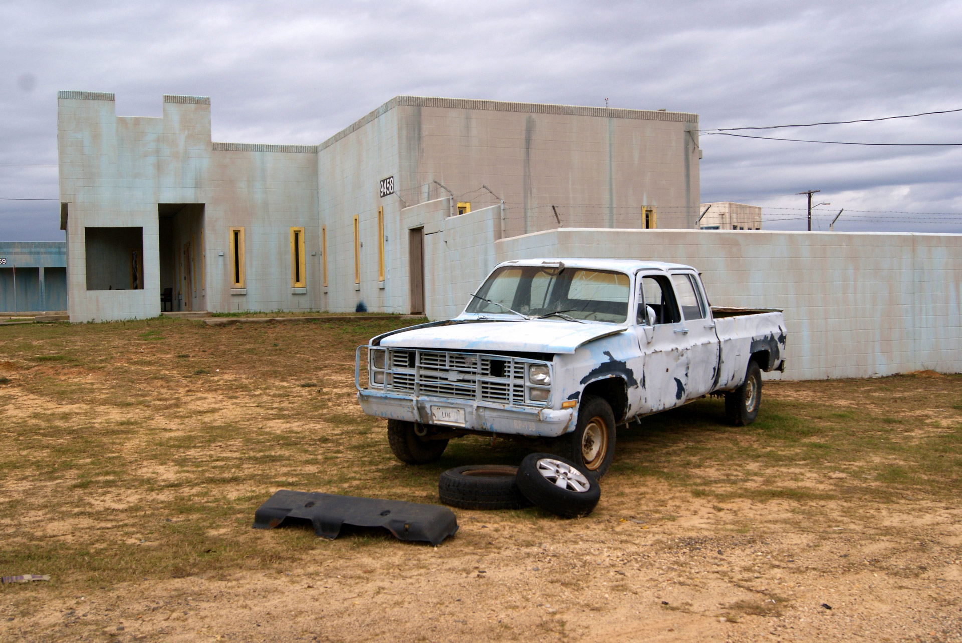 an old truck serving as a prop in the "city" of Dara Lam at Fort Polk