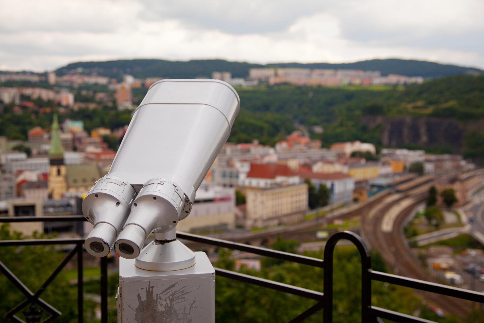 sightseeing telescope with a town view