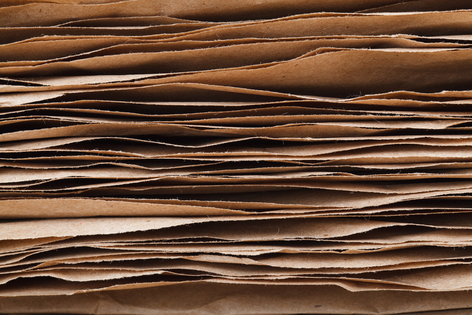stacked brown paper sheets on top of each other