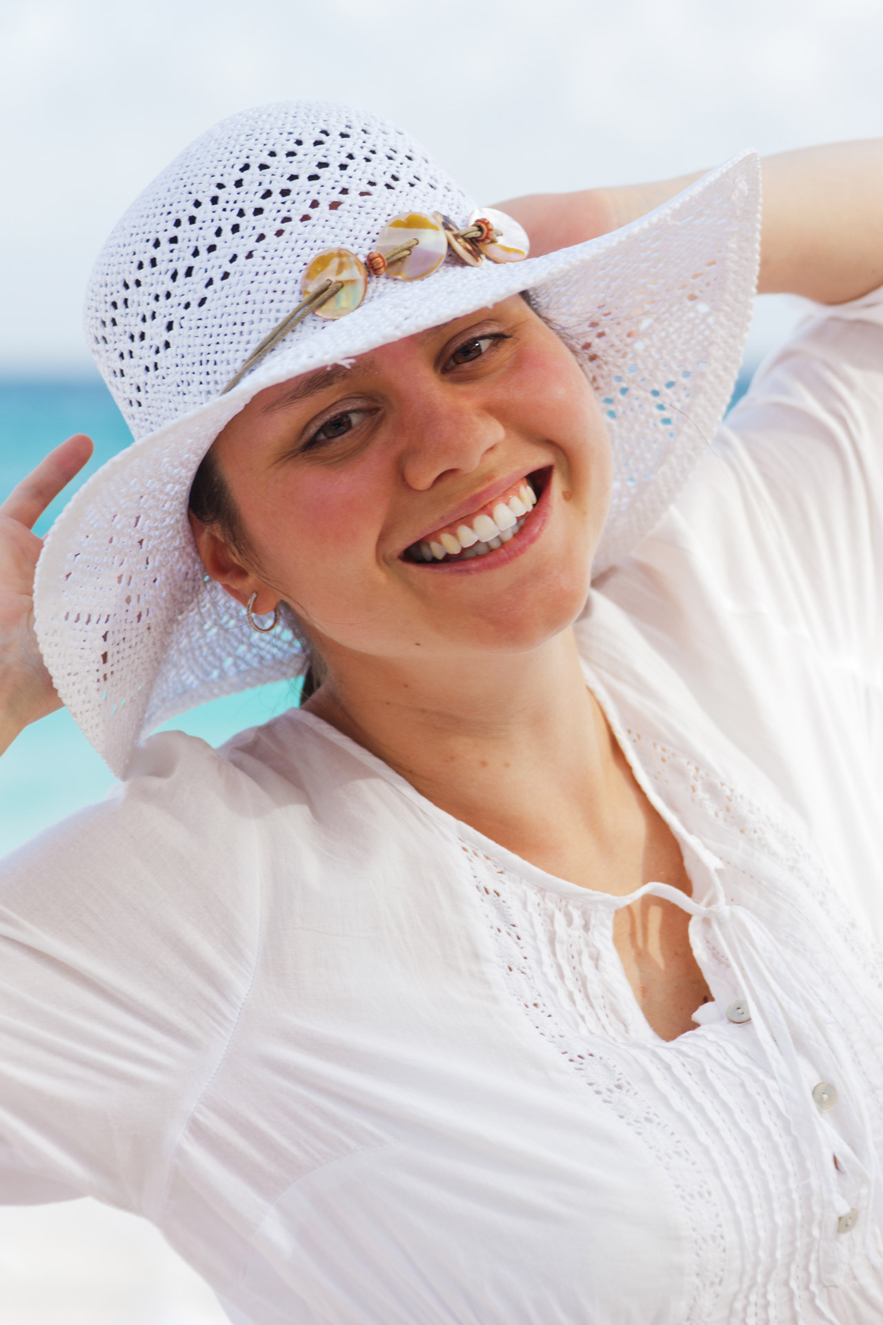 Woman With A Hat On Beach