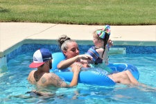 Family In Swimming Pool