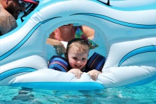Little Girl On Pool Float