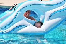 Mother And Daughter With Pool Float