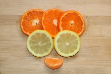 Orange And Lemon Slices On Wood