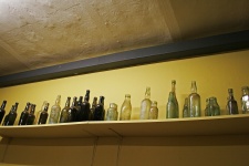 Row Of Vintage Bottle On High Shelf