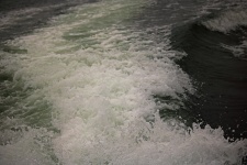Swell And Foam Behind A Power Boat