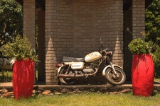 Vintage Motor Cycle Against A Wall