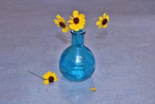 Yellow Wildflowers In Blue Vase