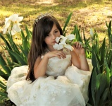 Young Girl Smelling Flower