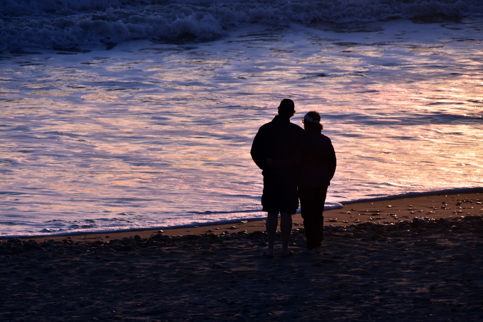 Couple Enjoying A Sunset