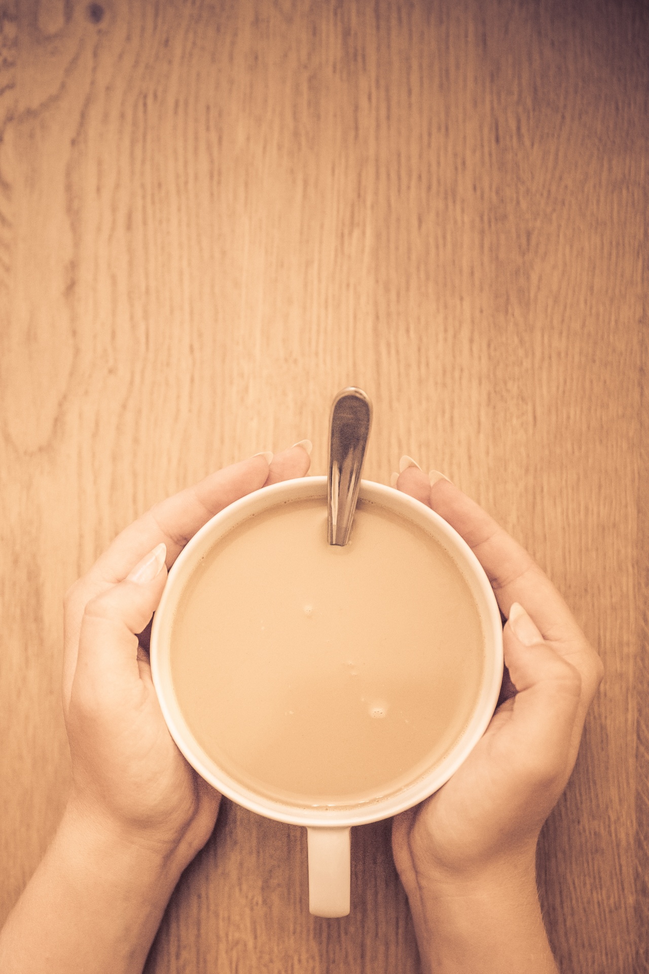 Hands Holding A Cup Of Coffee