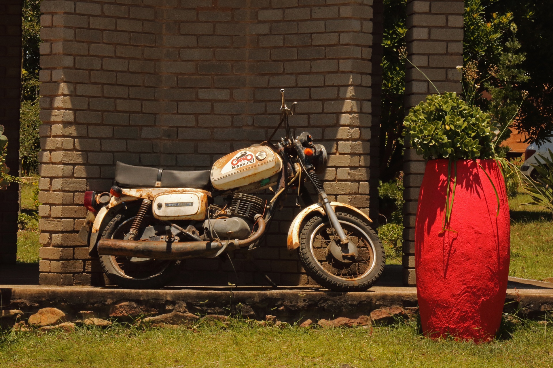 Old Motor Cycle Displayed In Garden