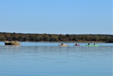 Family Kayaking On Blue Lake