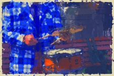 Man In Plaid Jacket Playing Drums