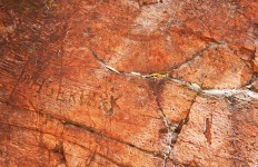 Name Faintly Inscribed In Red Rock