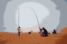 People Relaxing & Fishing On Beach