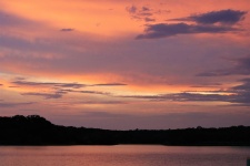 Purple And Orange Sunset Over Lake