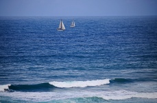Two White Sailed Yachts On The Sea