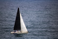 Yacht With Black And White Sails