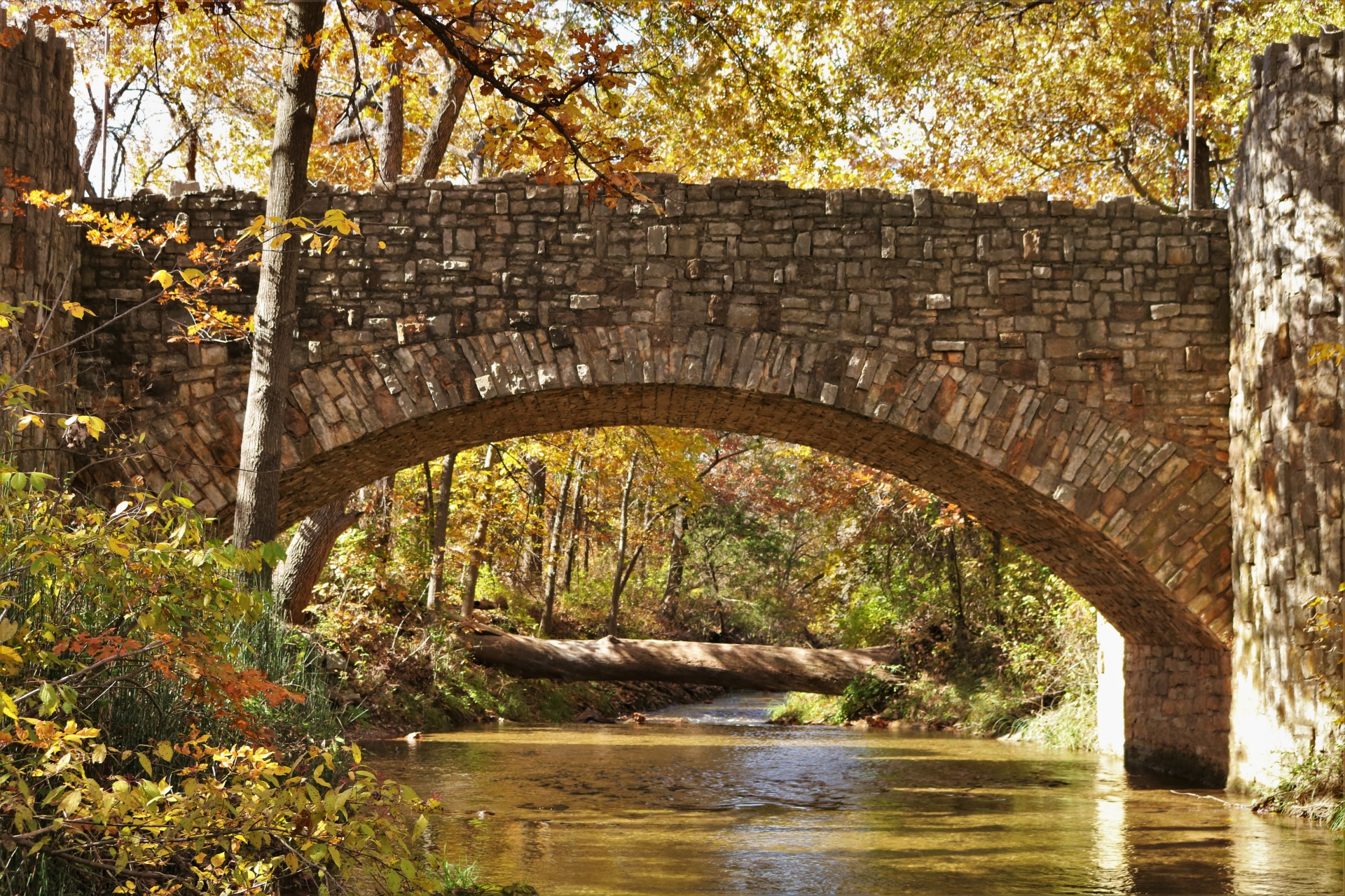 Arched Stone Bridge In Fall
