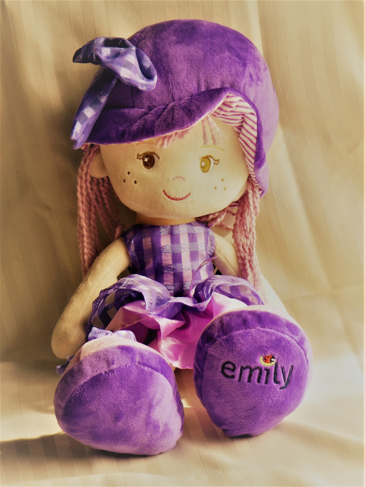 Stylized photo of a purple and gold rag doll