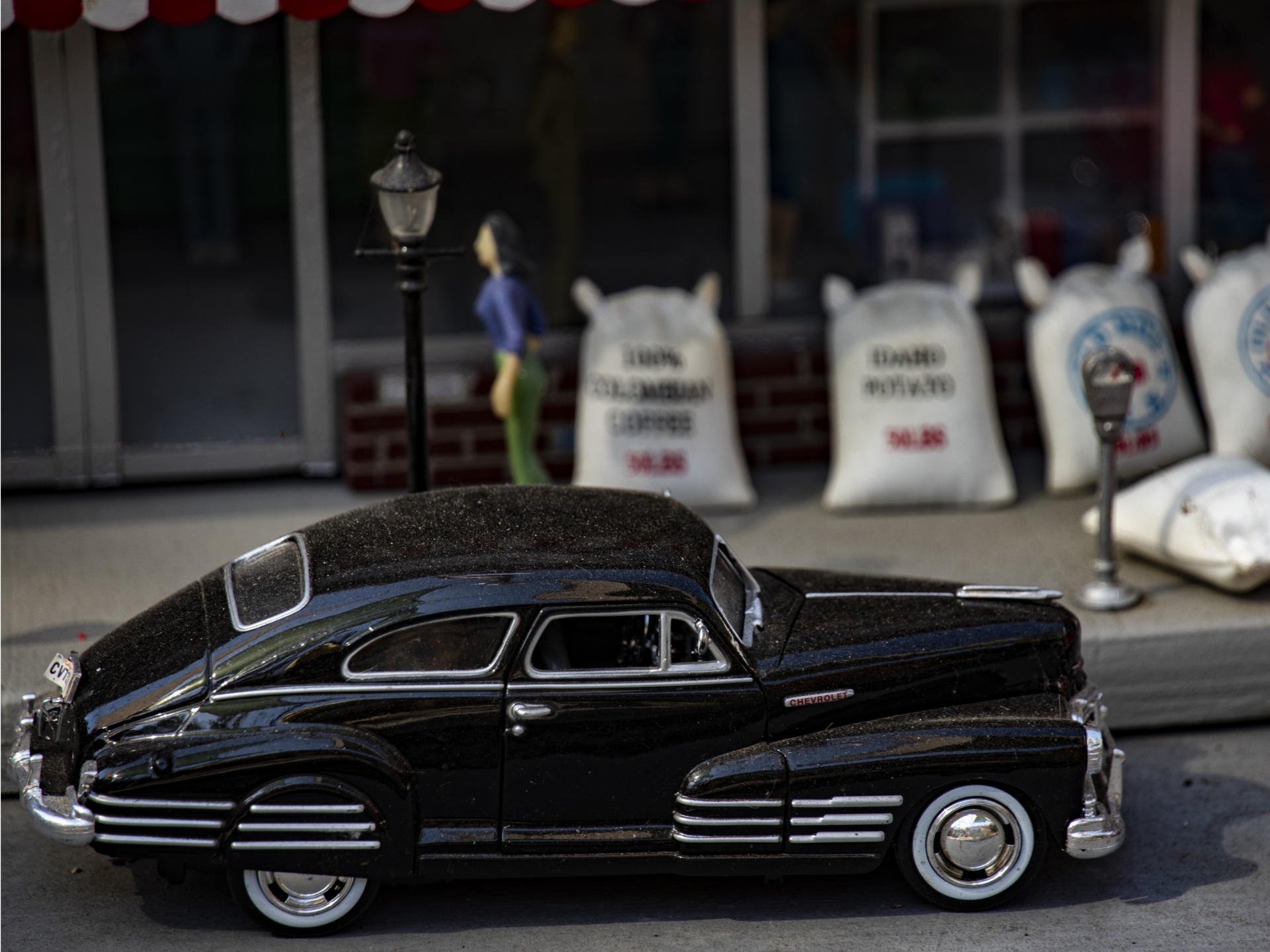 Vintage Black car and storefront