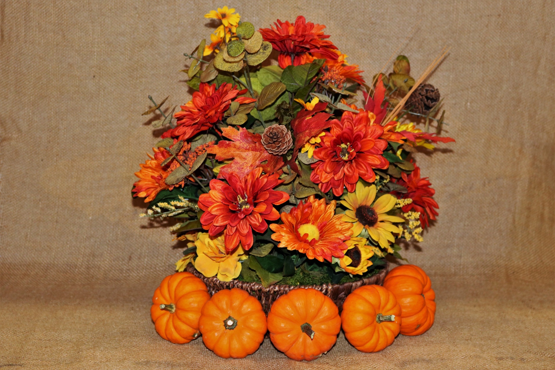 Pumpkins And Fall Flowers On Burlap