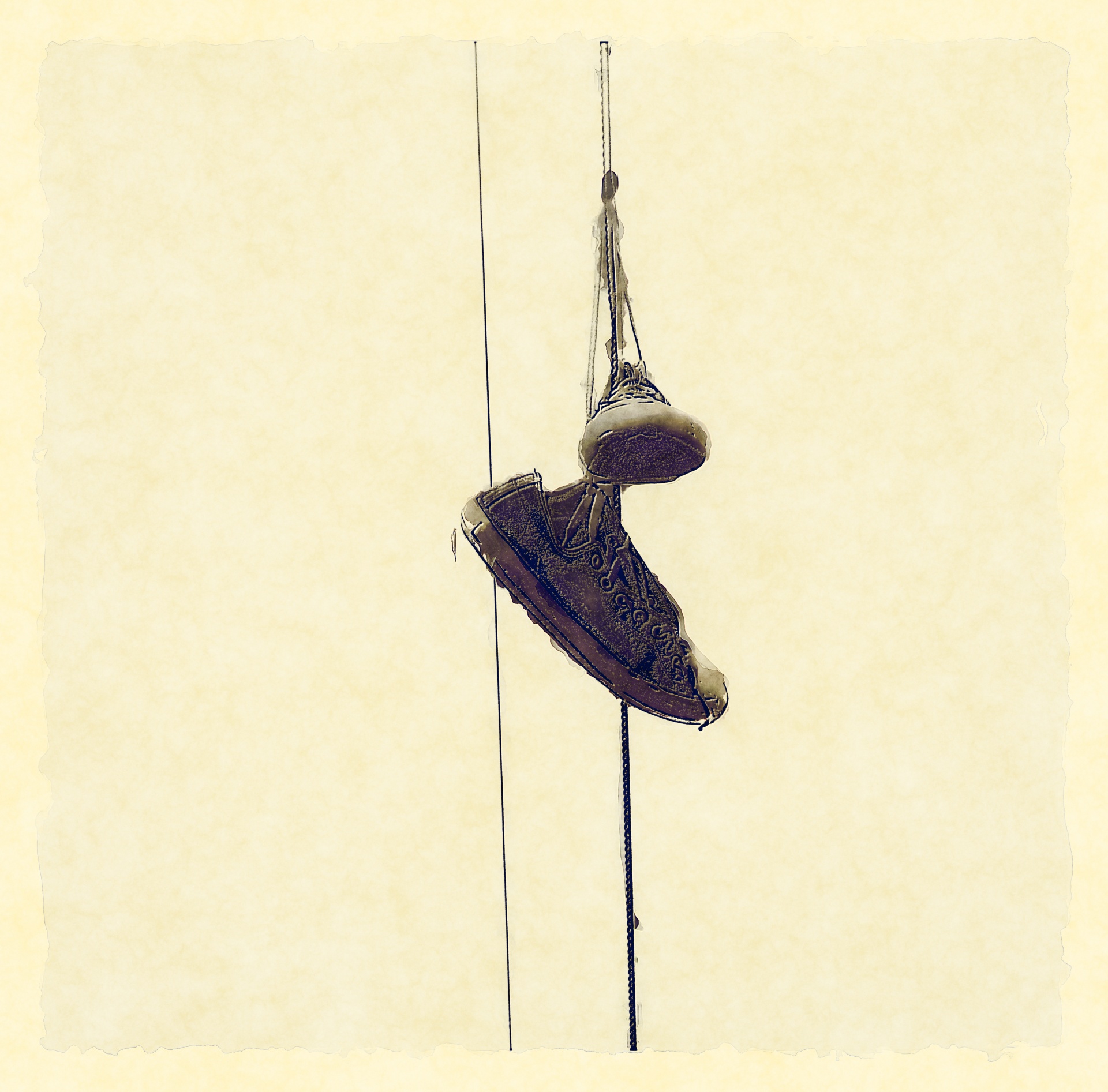 tennis shoes hanging on wire