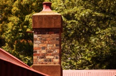 Brick Chimney On An Old House