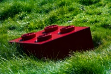 Giant Red Lego On Grass