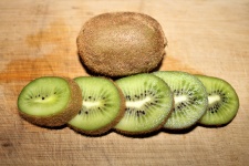 Kiwi Fruit On Wood Close-up