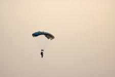 Parachutist Against Faint Glow