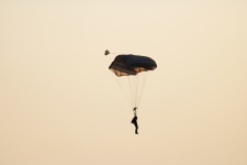 Parachutist Against Glowing Sky