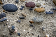 Pebbles In Damp Sand