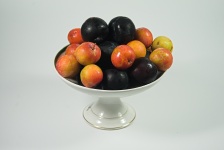 Plums In A Fruit Bowl