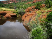Quiet Flow Of River Between Rocks