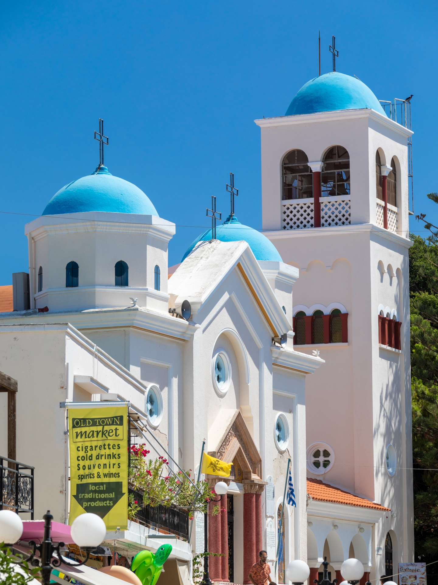 White church with blue roof in Greece
